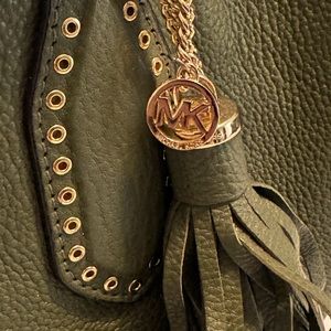 Michael Kors olive colored leather handbag.